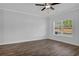 Simple living room with hardwood floors and a large window at 4131 Fulson Dr, Lilburn, GA 30047