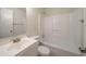 Standard bathroom featuring a shower-tub combo, toilet, and single sink at 1119 Summer Brook Rd, Atlanta, GA 30349