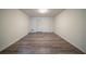 Spacious bedroom with wood-look floors, neutral walls, and ample closet space at 1119 Summer Brook Rd, Atlanta, GA 30349