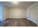 Bedroom featuring wood-look flooring, large closet, and several outlets at 1119 Summer Brook Rd, Atlanta, GA 30349