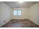 Cozy bedroom with wood-look floors, neutral walls, and natural light at 1119 Summer Brook Rd, Atlanta, GA 30349