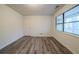 Bedroom featuring a large window with natural light and wood-look flooring at 1119 Summer Brook Rd, Atlanta, GA 30349