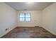 Spacious bedroom featuring wood-look flooring and plenty of natural light at 1119 Summer Brook Rd, Atlanta, GA 30349