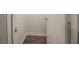 Walk-in closet featuring wood-look flooring and baseboards at 1119 Summer Brook Rd, Atlanta, GA 30349