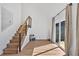 Bright living room with hardwood floors, staircase, and sliding glass door to deck at 1284 Falling Water Se Dr, Smyrna, GA 30080