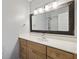 Bathroom with large vanity mirror, light wood cabinets, and shower at 2657 Lenox Ne Rd # 134-2, Atlanta, GA 30324