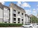 Attractive condo building with private balconies and well-maintained landscaping at 2657 Lenox Ne Rd # 134-2, Atlanta, GA 30324