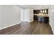 Open living room and kitchen area with dark hardwood floors at 2657 Lenox Ne Rd # 134-2, Atlanta, GA 30324