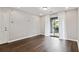 Living room with dark hardwood floors and access to balcony at 2657 Lenox Ne Rd # 134-2, Atlanta, GA 30324