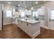 Gourmet kitchen featuring white cabinets, granite counters, and hardwood floors at 2914 Battlecrest Dr, Decatur, GA 30034