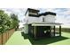 Modern two-story home featuring a covered patio, sleek white and black finishes, and a fenced yard at 3534 Rockhaven Ne Cir, Atlanta, GA 30324