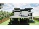 Modern two-story home showcasing a covered patio, large windows, and a fenced yard at 3534 Rockhaven Ne Cir, Atlanta, GA 30324