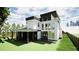 Modern two-story home featuring a covered patio, large windows, and a fenced yard at 3534 Rockhaven Ne Cir, Atlanta, GA 30324