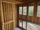 Framing of a new home with tall windows for natural light and nature views at 3534 Rockhaven Ne Cir, Atlanta, GA 30324