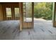Unfinished living room showing stud framing, large windows, and wooded views from the surrounding property at 3534 Rockhaven Ne Cir, Atlanta, GA 30324
