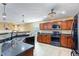 Modern kitchen with stainless steel appliances and dark countertops at 5720 Graywind Trl, Atlanta, GA 30349