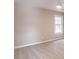 A simple bedroom features neutral walls, soft carpet, and a bright window at 2107 Kendall Close Nw, Acworth, GA 30102