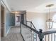 Upstairs hallway features dark trim, carpeting, and decorative lighting fixture at 2107 Kendall Close Nw, Acworth, GA 30102