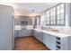 Beautiful kitchen with gray cabinetry, stainless steel appliances, and hardwood floors at 2107 Kendall Close Nw, Acworth, GA 30102