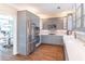 Spacious kitchen with gray cabinetry, stainless steel appliances, and hardwood floors at 2107 Kendall Close Nw, Acworth, GA 30102