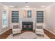 Cozy living room featuring a fireplace and custom built-in shelving at 2107 Kendall Close Nw, Acworth, GA 30102