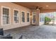 Covered patio with stone flooring, ceiling fan, and a view of the backyard at 2107 Kendall Close Nw, Acworth, GA 30102