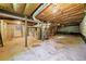 Unfinished basement with exposed utilities and concrete floor at 241 W Simon Nw Ter, Atlanta, GA 30318