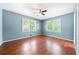 Spacious bedroom with light blue walls and hardwood floors at 241 W Simon Nw Ter, Atlanta, GA 30318