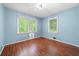 Bright bedroom with light blue walls and hardwood floors at 241 W Simon Nw Ter, Atlanta, GA 30318