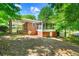 Brick ranch house with a screened porch and a fenced backyard at 241 W Simon Nw Ter, Atlanta, GA 30318