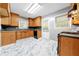 Kitchen with oak cabinets and marble-look floors at 241 W Simon Nw Ter, Atlanta, GA 30318