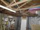 Unfinished attic space with exposed beams and storage at 3566 Carry Ct, Snellville, GA 30039