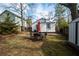 Well-maintained backyard with a dining set and an outdoor shed for extra storage space at 953 Garibaldi Sw St, Atlanta, GA 30310