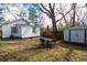 Backyard featuring an outdoor dining set and a storage shed, perfect for outdoor gatherings at 953 Garibaldi Sw St, Atlanta, GA 30310