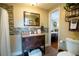 Well-lit bathroom featuring a modern vanity and decorative tile accents at 953 Garibaldi Sw St, Atlanta, GA 30310