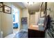 Bright bathroom featuring a modern vanity and decorative tile accents at 953 Garibaldi Sw St, Atlanta, GA 30310