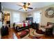 Inviting bedroom featuring a ceiling fan and hardwood flooring at 953 Garibaldi Sw St, Atlanta, GA 30310