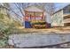 Cute cottage with a stone wall and landscaped yard at 953 Garibaldi Sw St, Atlanta, GA 30310