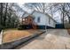 Home featuring a welcoming front porch and long driveway at 953 Garibaldi Sw St, Atlanta, GA 30310