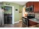 Kitchen featuring stainless appliances and adjacent laundry closet at 953 Garibaldi Sw St, Atlanta, GA 30310