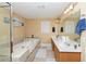 Large bathroom with a garden tub and double sinks at 1553 Rolling Meadows Dr, Mcdonough, GA 30253