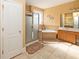 Bathroom with double vanity, soaking tub, and shower at 1553 Rolling Meadows Dr, Mcdonough, GA 30253