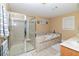 Bathroom featuring a shower and a large soaking tub at 1553 Rolling Meadows Dr, Mcdonough, GA 30253