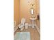 Small bathroom with pedestal sink, toilet, and decorative rug at 1553 Rolling Meadows Dr, Mcdonough, GA 30253