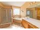 Bathroom boasts a corner soaking tub and double vanity at 1553 Rolling Meadows Dr, Mcdonough, GA 30253