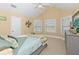 Bedroom with vaulted ceiling, neutral decor, and ample natural light at 1553 Rolling Meadows Dr, Mcdonough, GA 30253