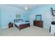 Spacious bedroom with light blue walls and a comfortable bed at 1553 Rolling Meadows Dr, Mcdonough, GA 30253