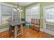 Bright breakfast nook with wood floors and access to backyard at 1553 Rolling Meadows Dr, Mcdonough, GA 30253