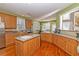 Spacious kitchen with light wood cabinets, island, and stainless steel appliances at 1553 Rolling Meadows Dr, Mcdonough, GA 30253