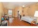 Large main bedroom with hardwood floors and ceiling fan at 1553 Rolling Meadows Dr, Mcdonough, GA 30253
